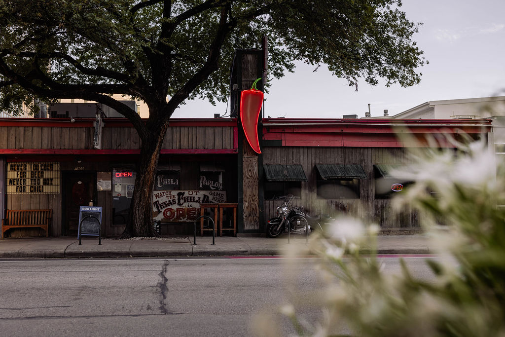 Interior of the Texas Chili Parlor, showing the bar and vintage atmosphere